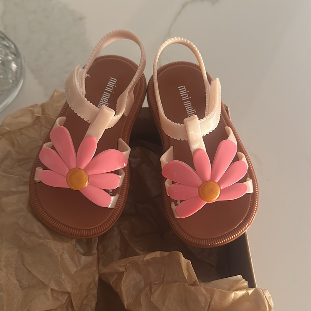 Mini Melissa size 7 toddler sandal. Never worn. New with box.